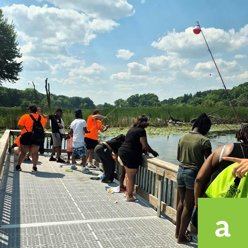 People fishing from a dock