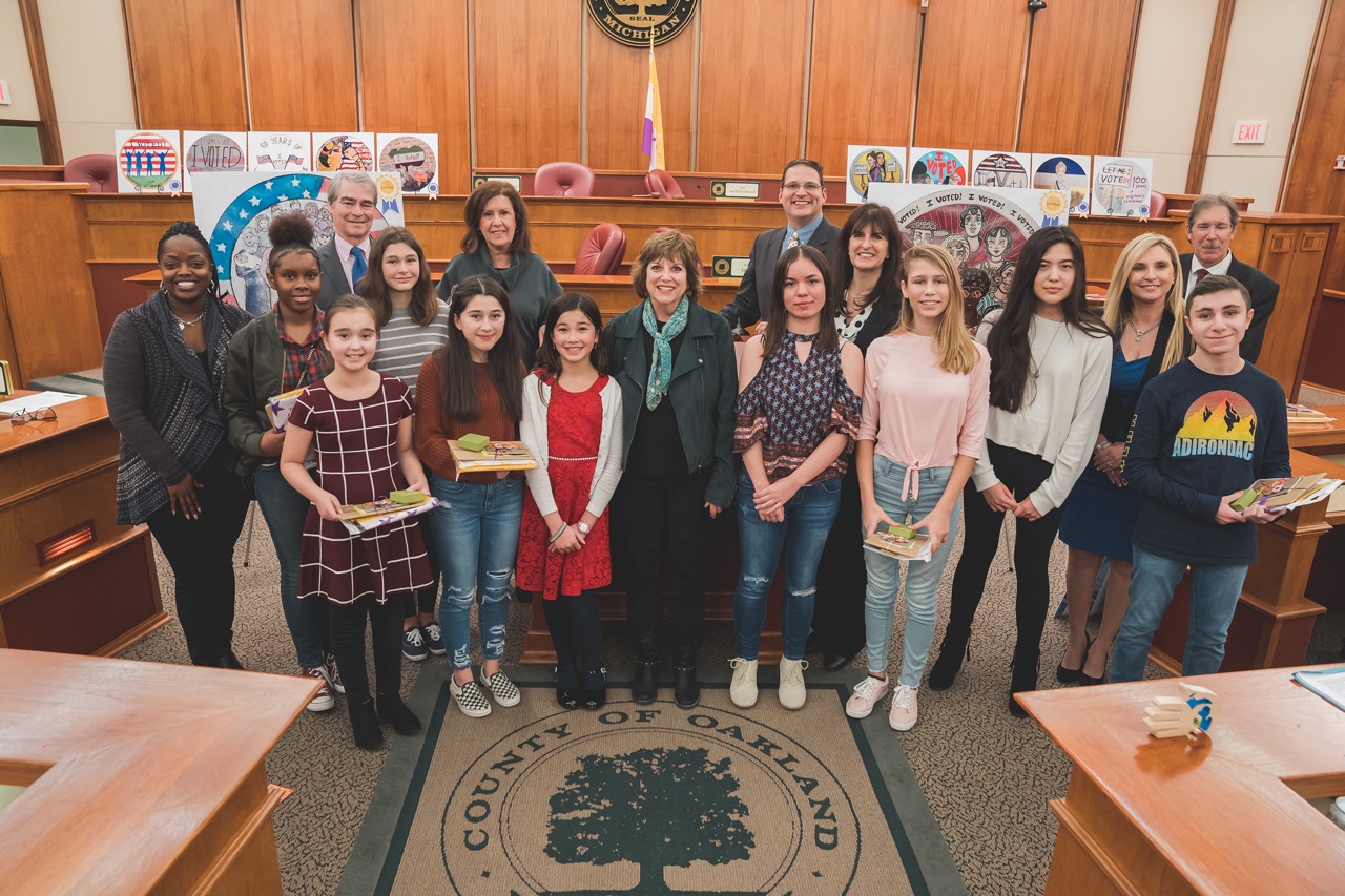 Contest winners and honorable mentions with (left to right) Angela Powell, Dr. Michael Yocum, Hedy Blatt, Marcia Gershenson, Dave Woodward, Clerk Lisa Brown, Heidi Kassab and Phil Weipert.