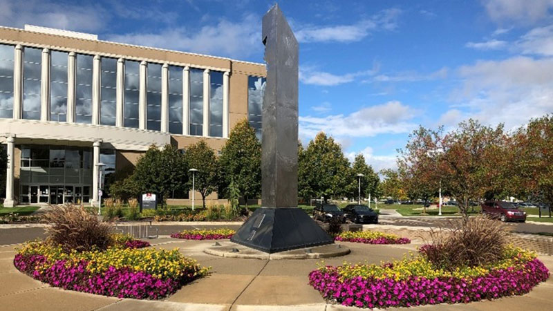 Flowers planted in front of the courthouse entrance.