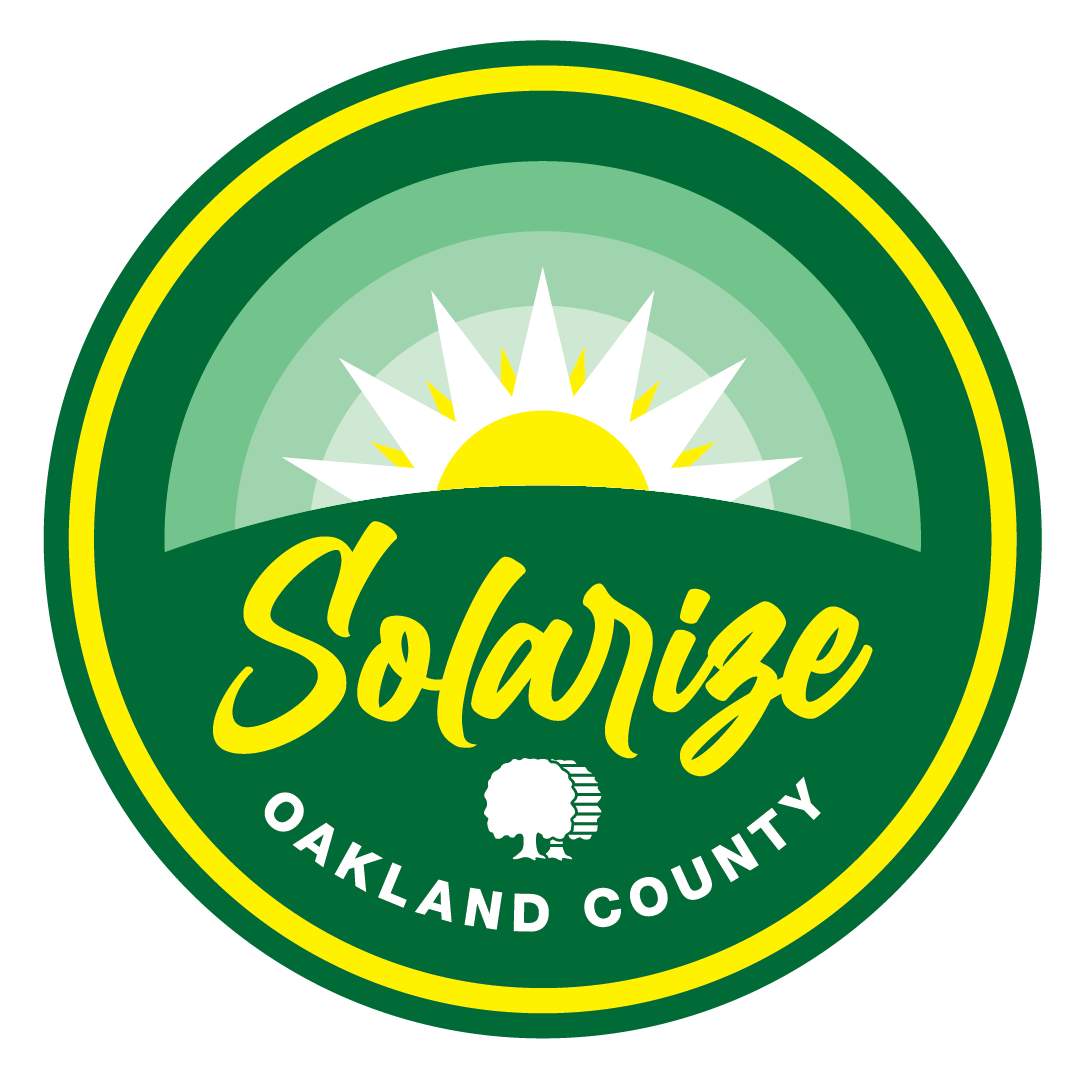 An emblem that shows the sun rising over a hill and says