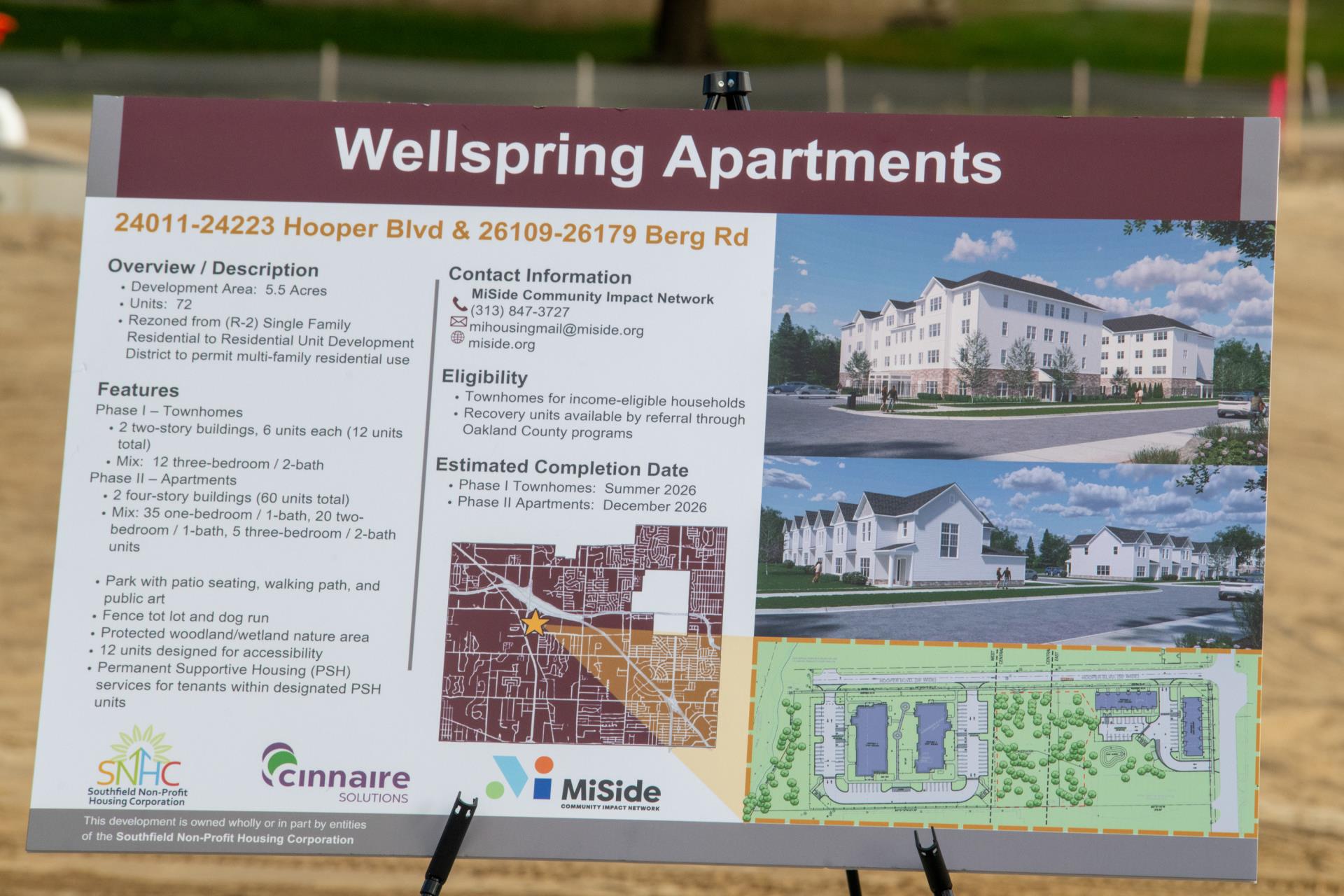 A poster board of Wellspring Apartments map and project details.