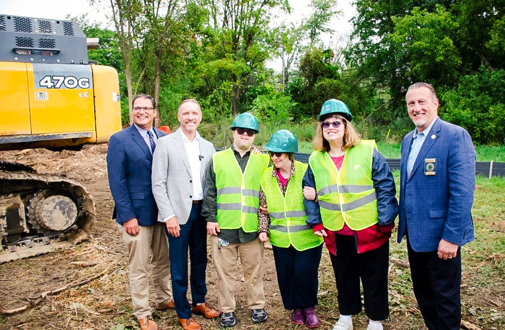A group of investors and future housing clients Walton Oaks groundbreaking. Project investors and future residents at Walton Oaks construction site.