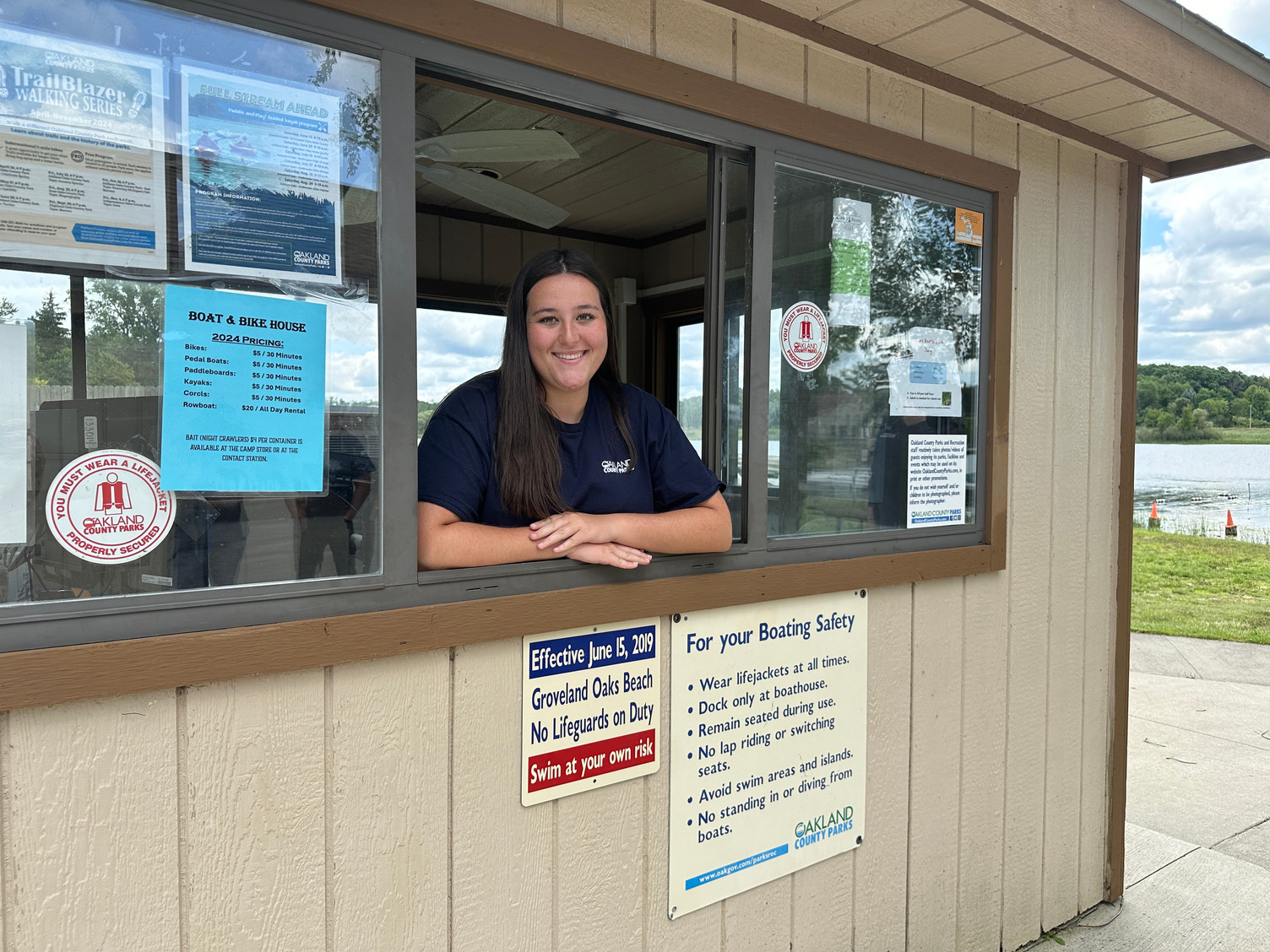 Young woman working in Groveland Oaks booth