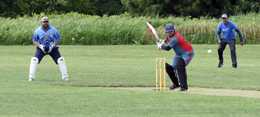 group of people playing Cricket at Lyon Oaks park
